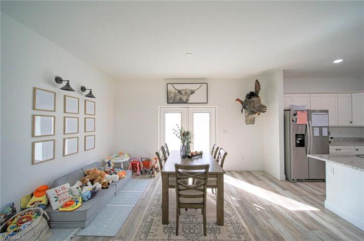 Large Dining Area With Double Glass French Doors Leading Out To The Back Yard!!