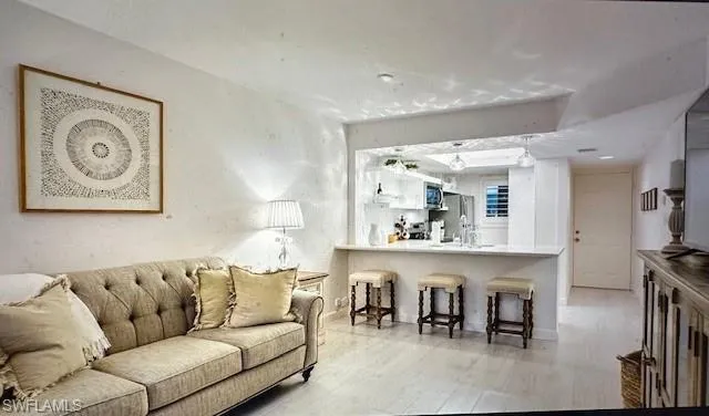 Living area featuring light wood-type flooring