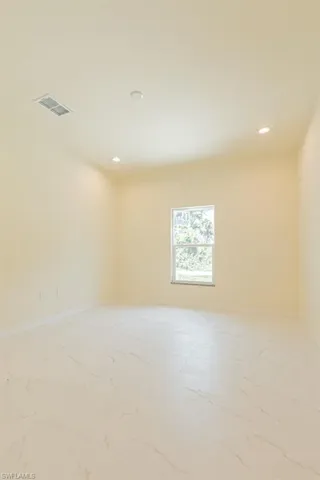 View of tiled spare room