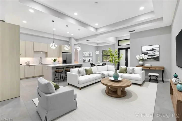 Virtual staged - Living area featuring recessed lighting and baseboards
