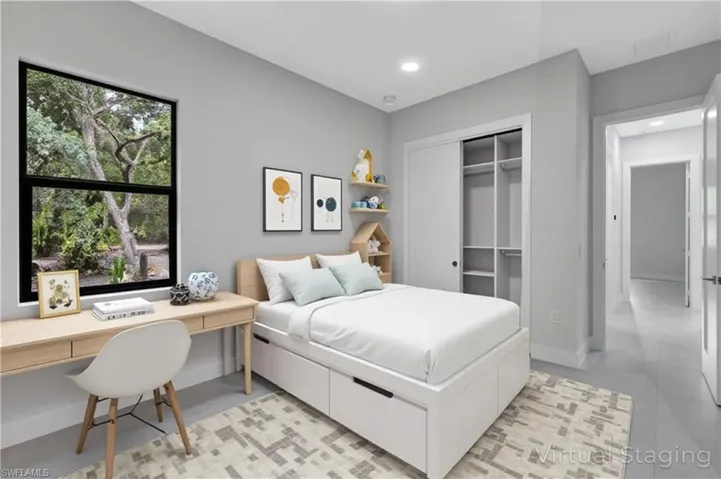 Virtual staged - Bedroom featuring a closet, an office area, and recessed lighting
