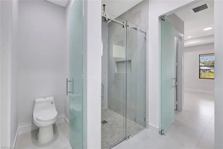 Full bath with a stall shower and recessed lighting