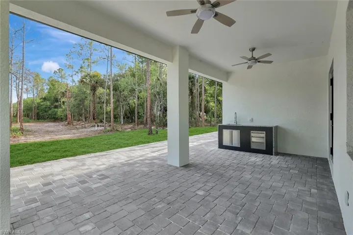 View of patio / terrace featuring exterior kitchen and a ceiling fan