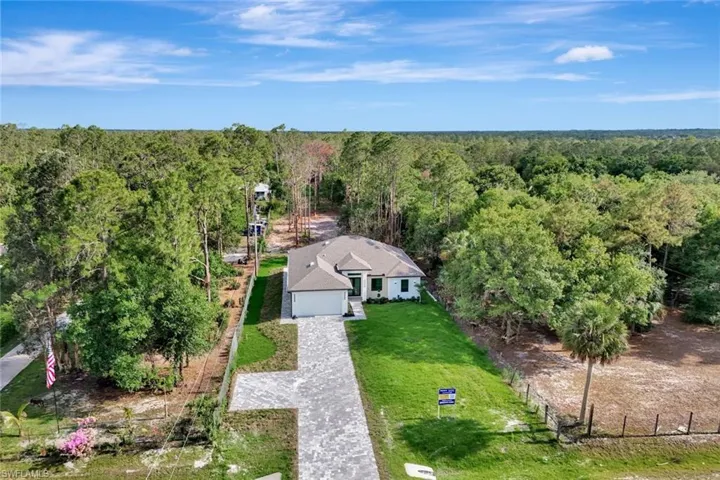 View from above of property featuring a forest