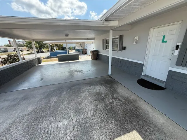 View of patio with a carport