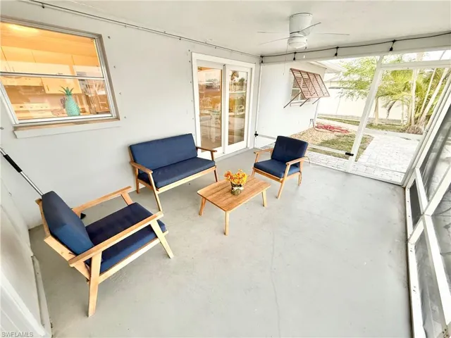 Sunroom with a ceiling fan