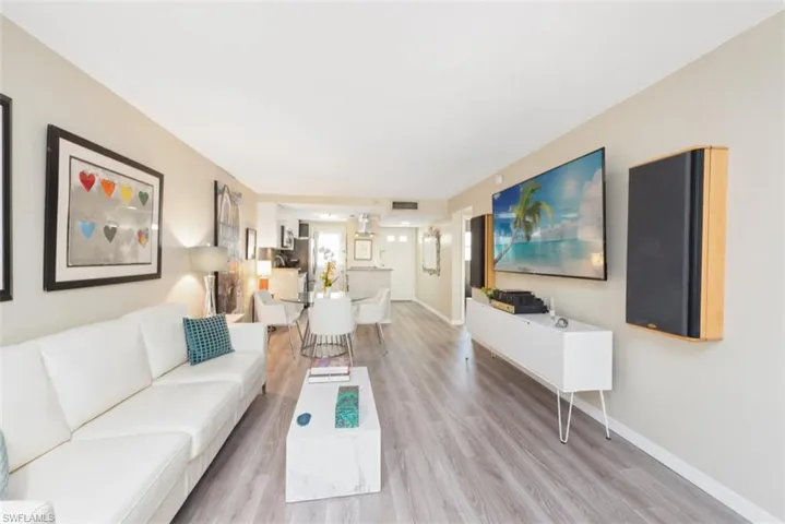 Living room with hardwood / wood-style flooring
