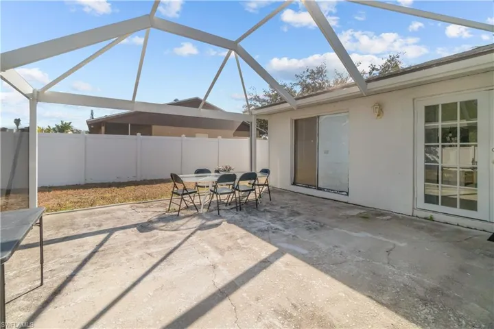 View of patio / terrace featuring outdoor dining space, a sunroom, and a lanai