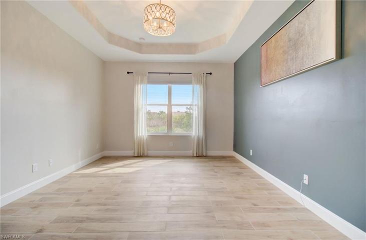 Master Bedroom, with tray Ceiling and Tile Floors