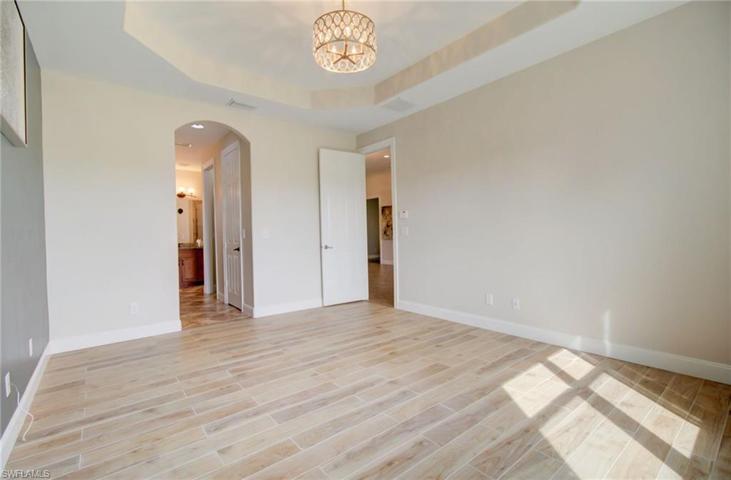 Master Bedroom, with tray Ceiling and Tile Floors