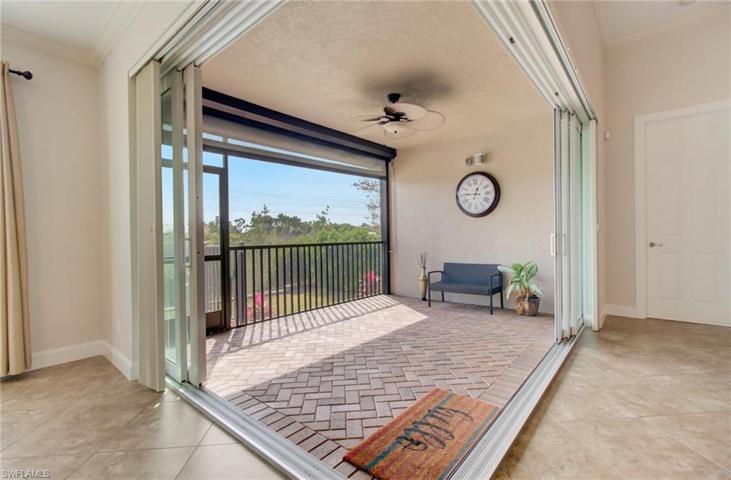 Covered Screened Lania, with L-shaped sliders for indoor outdoor living also has Hurricane Roll Down Fabric.