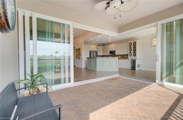 Covered Screened Lania, with L-shaped sliders for indoor outdoor living also has Hurricane Roll Down Fabric.