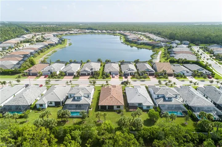 Aerial view of residential area with a large body of water