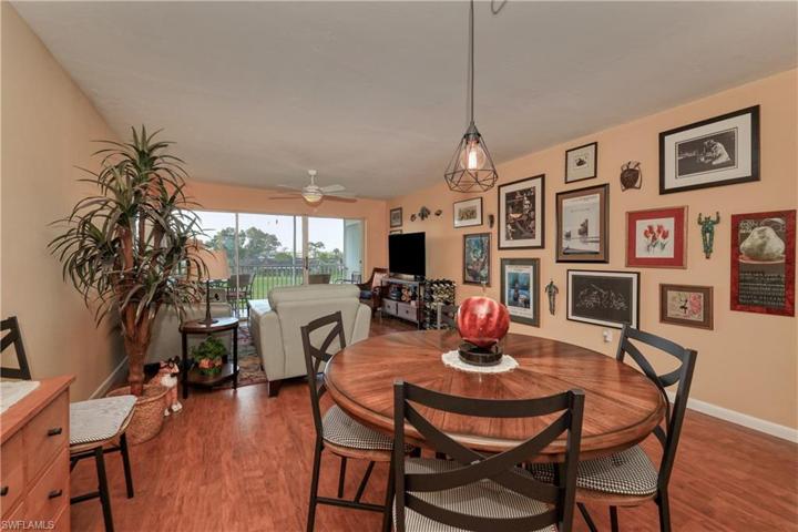 Dining area overlooking the living area and screened lanai.