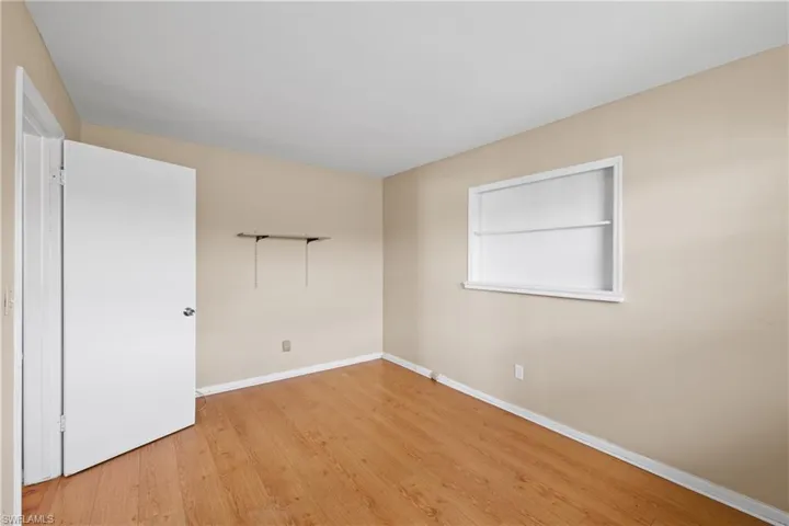 Spare room featuring light wood-type flooring