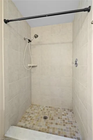 Bathroom featuring tiled shower