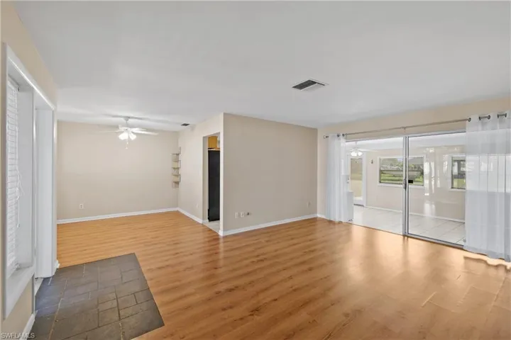 Great room featuring ceiling fan and hardwood / wood-style flooring