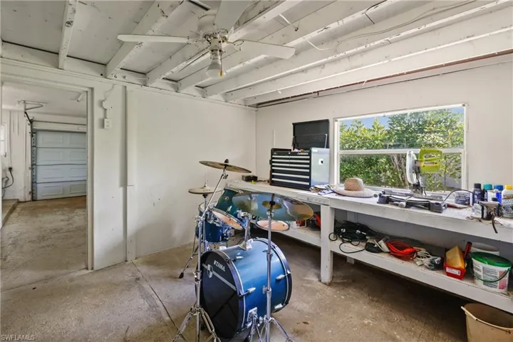 Miscellaneous room featuring concrete floors and ceiling fan