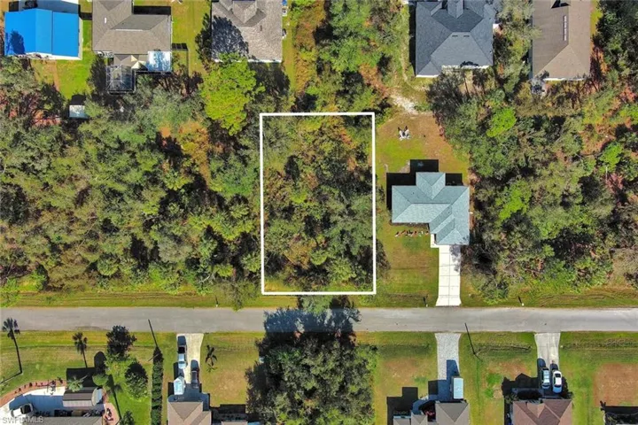 Aerial perspective of suburban area with property boundaries highlighted
