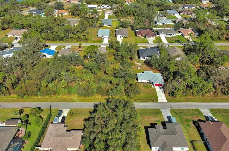 Aerial overview of property's location with nearby suburban area