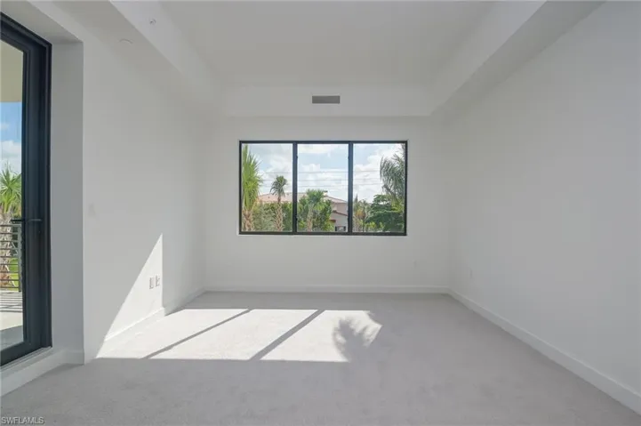 Primary bedroom with access to balcony area