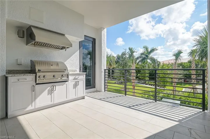 Large balcony space with outdoor kitchen and access from both bedrooms as well as living room