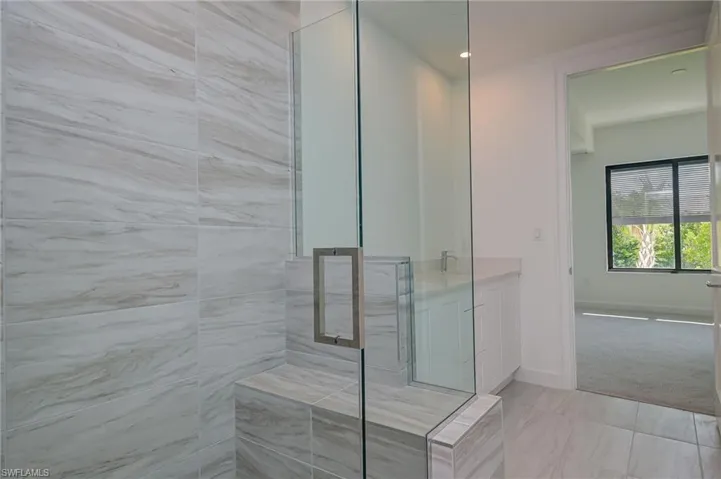 2nd bedroom ensite bathroom with contemporary tile throughout