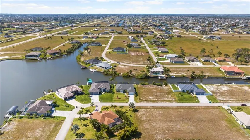 Drone / aerial view featuring a residential view and a water view