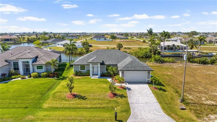 Birds eye view of property featuring a residential view and a water view