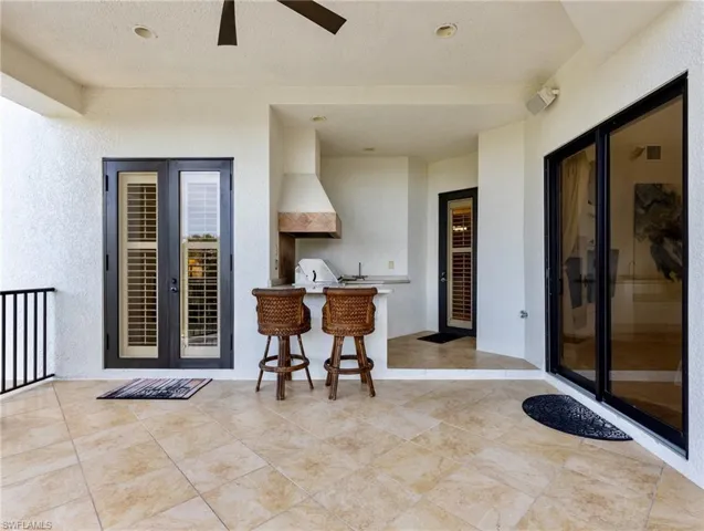 View of patio / terrace featuring grilling area and ceiling fan