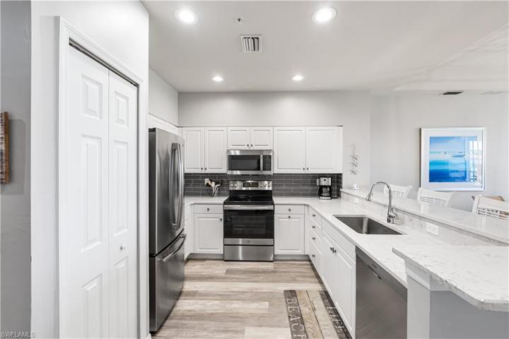 Entertain Family and Guests in the open concept Kitchen featuring all new appliances, white cabinetry, Quartz countertop with comfort height seating and Pantry.