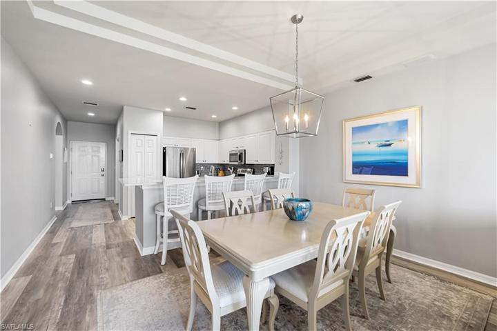6 Seat dining table w/overhead lighting fixture.