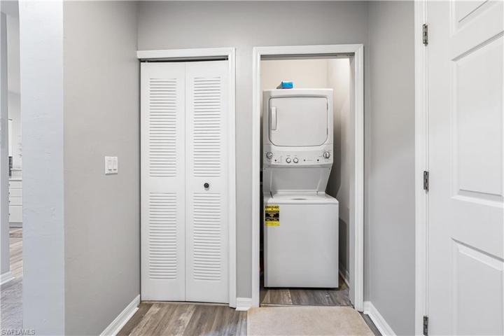 Laundry Closet w/Stacked Washer and Dryer.