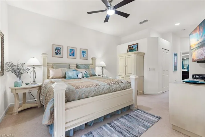 Bedroom featuring recessed lighting, light colored carpet, a ceiling fan, baseboards, and visible vents