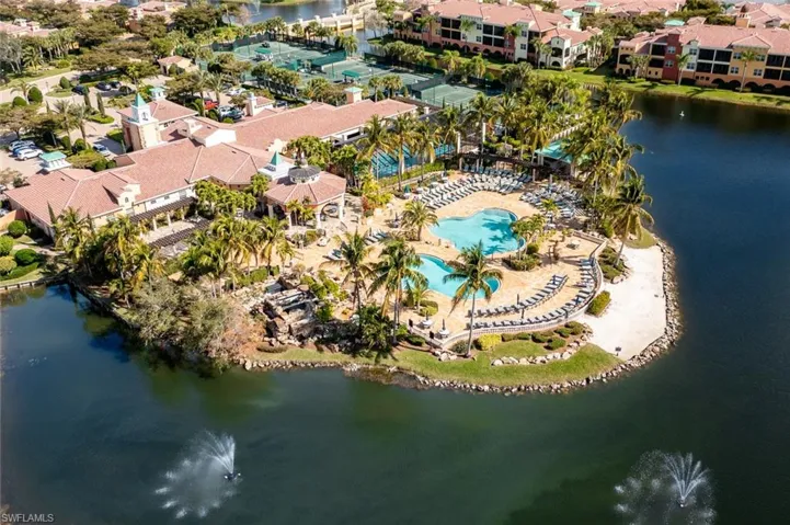 Birds eye view of property with a water view and a residential view