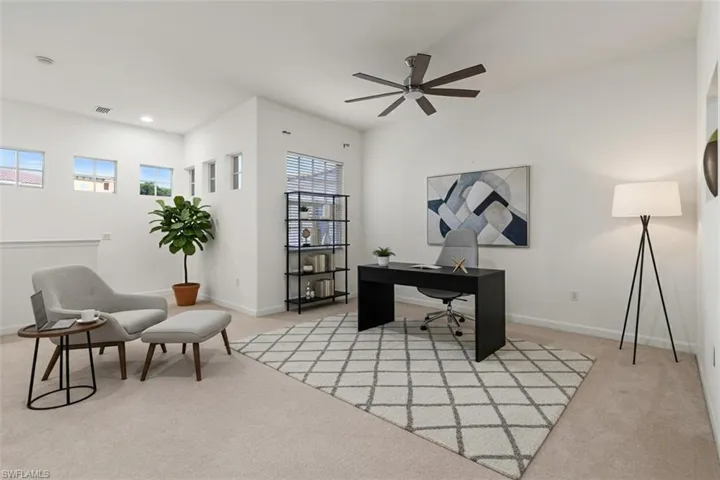 Home office featuring light carpet, a ceiling fan, and recessed lighting