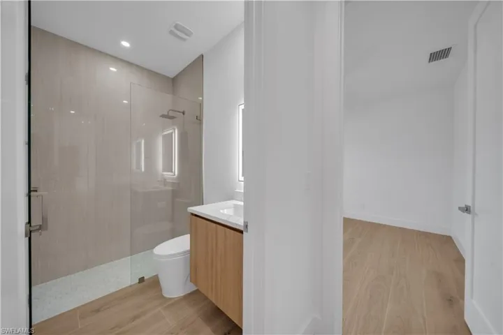 Unfurnished room featuring wood finished floors and ceiling fan