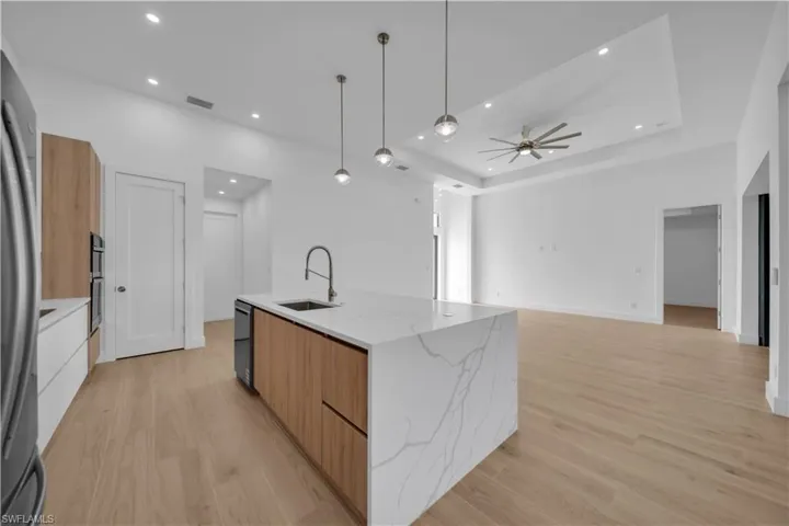 Spare room featuring light wood-style floors and ceiling fan