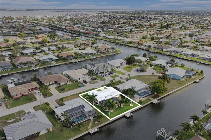 Aerial view of residential area with a nearby body of water