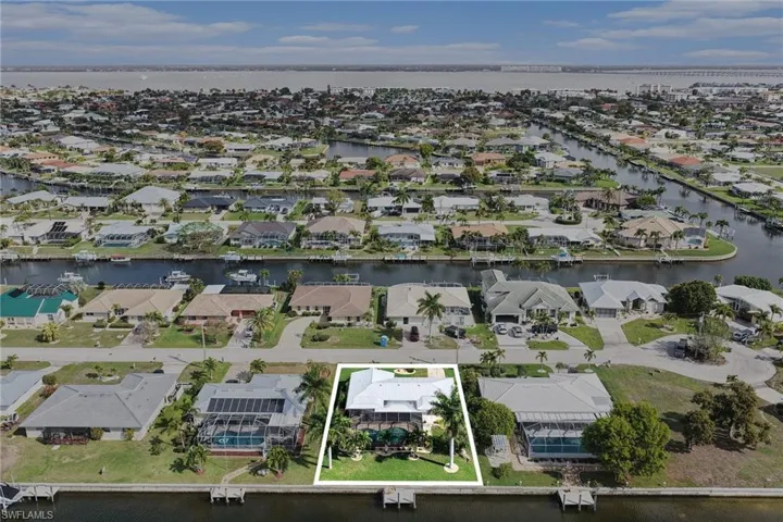 Aerial view of residential area with a nearby body of water