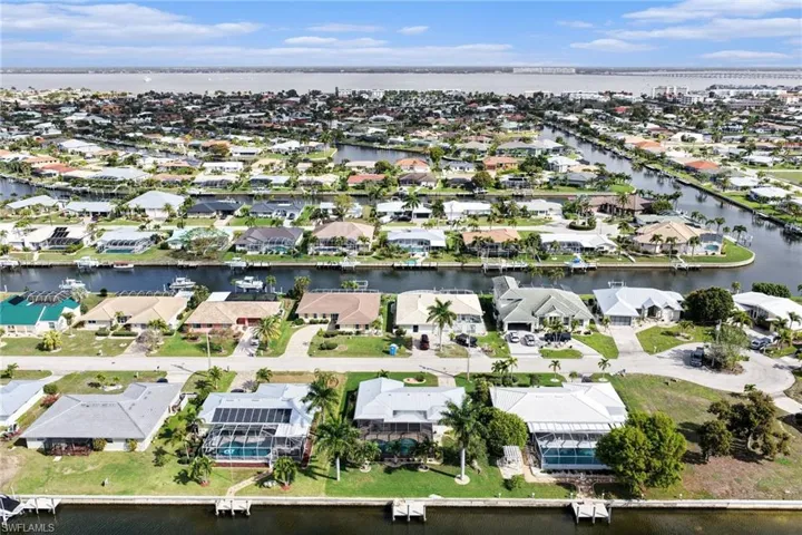 Aerial perspective of suburban area with a nearby body of water