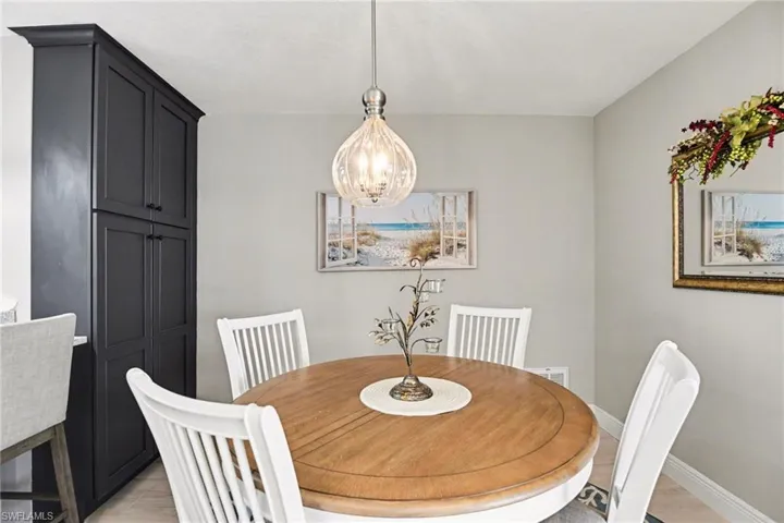 Dining room with baseboards and suspended lighting
