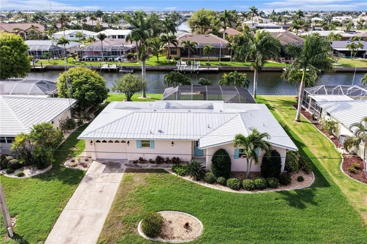 Aerial view of residential area with a nearby body of water