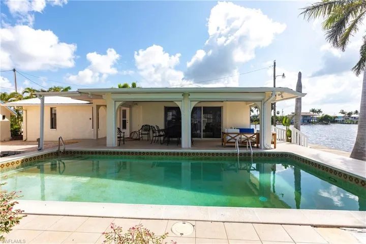 Swimming pool with a patio