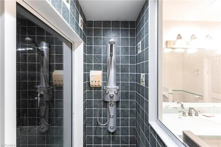 Full bathroom featuring a tile shower