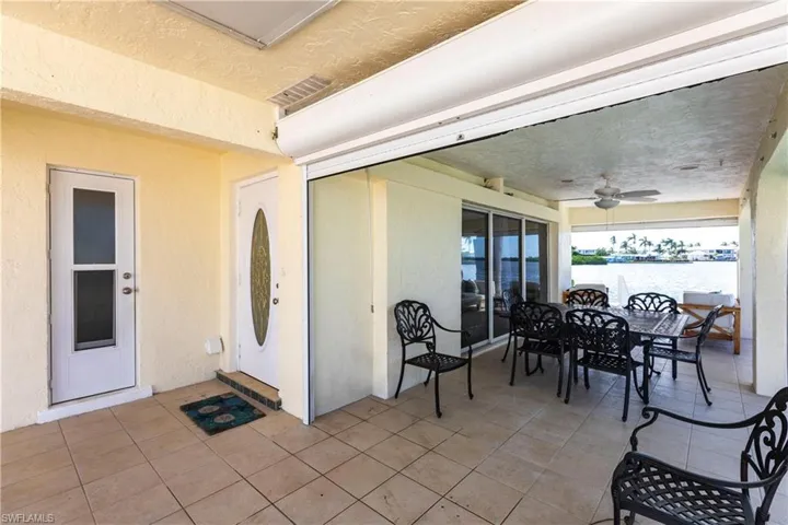 View of patio / terrace with a ceiling fan and outdoor dining space