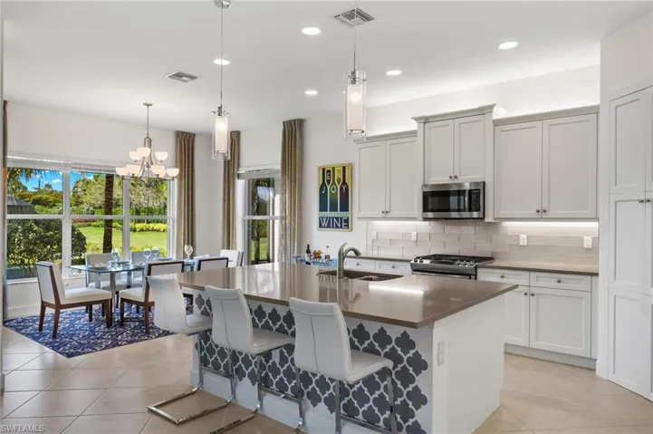 Dining area can seat 8 easily, has 5 windows, connects to the kitchen for easy entertaining!