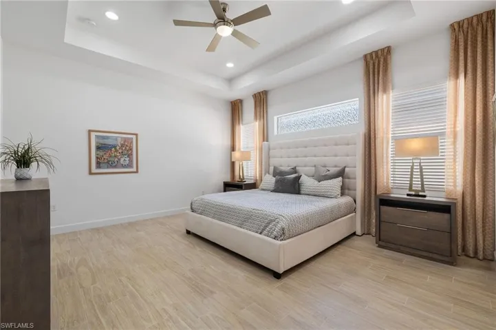 MBR features a tray ceiling, ceiling fan, w/ original carpeting replaced w/ LVT in '19.
