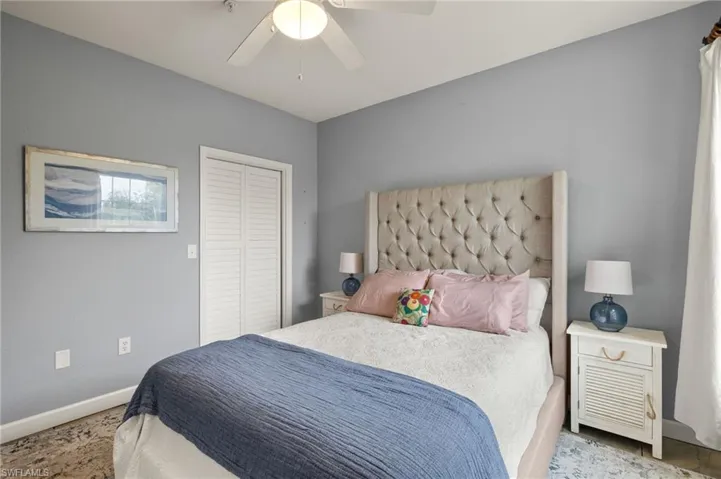 Bedroom featuring ceiling fan and a closet