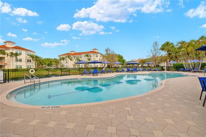 Community pool featuring a patio area
